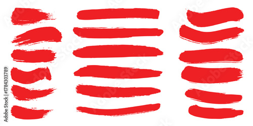 Bold red vector brush stroke set featuring wavy paint lines and textured marks, isolated elements for modern graphic design, banners, labels, and backgrounds.
