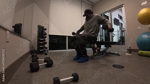 Man Performing Seated Dumbbell Lateral Raises for Shoulders


