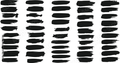 Collection of black brush strokes and paint splatters on a white background