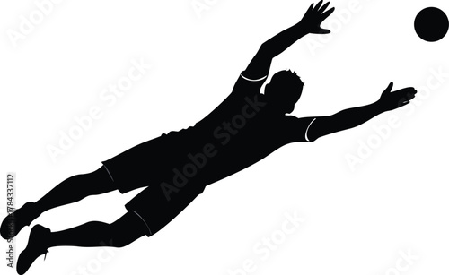 Silhouette of a soccer goalkeeper diving to save the ball in action