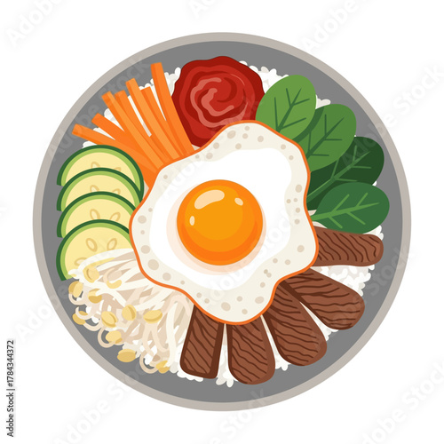 Overhead view of a bowl of bibimbap with various toppings and a fried egg.