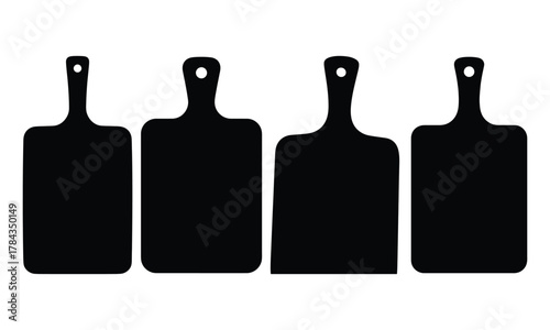Four identical black kitchen cutting board silhouettes on a white backdrop