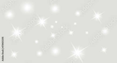 Sparkling light effect on a gray background creates a magical glow