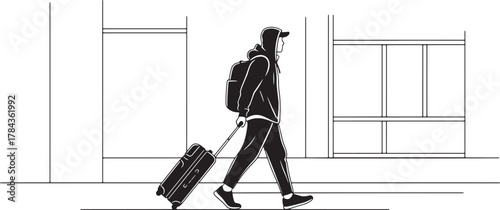 Silhouette of a person with a backpack pulling a suitcase