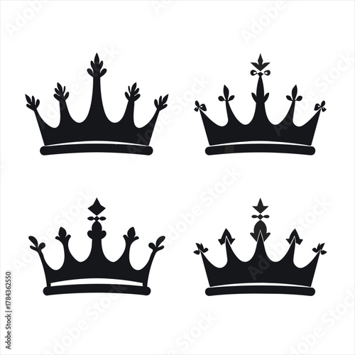 A set of four black royal crown silhouettes. Elegant and minimal king and queen vector icons. Symbols of power and luxury isolated on a light background. Perfect for logos
