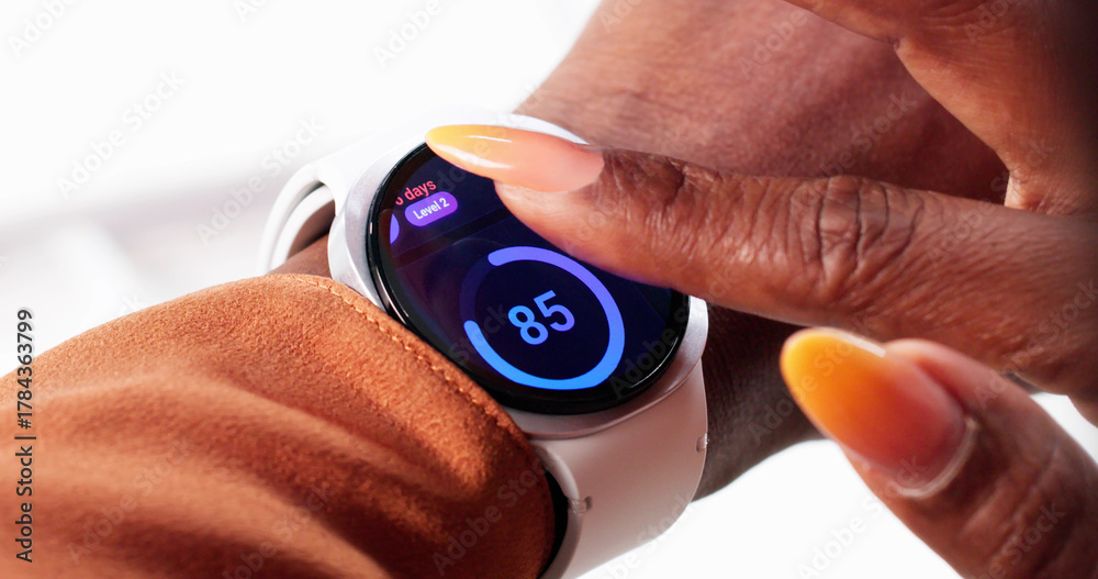 Fototapeta premium Professional Athlete Uses Heart Rate Monitor During Intense Fitness