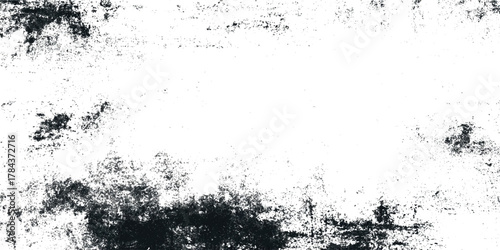 High-resolution black and white grunge texture with distressed ink splatter and rough distressed and subtle scratches.