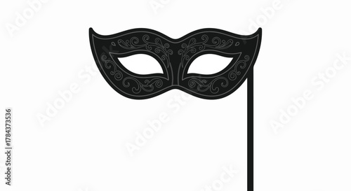 Black masquerade mask on a stick with ornate floral details.