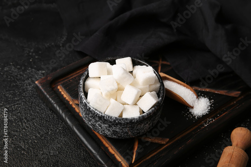 Bowl with white sugar cubes...