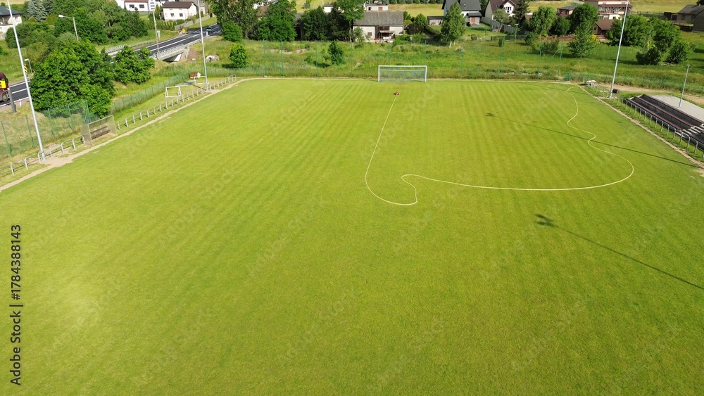 Obraz premium Football field watering using autonomous irrigation machine