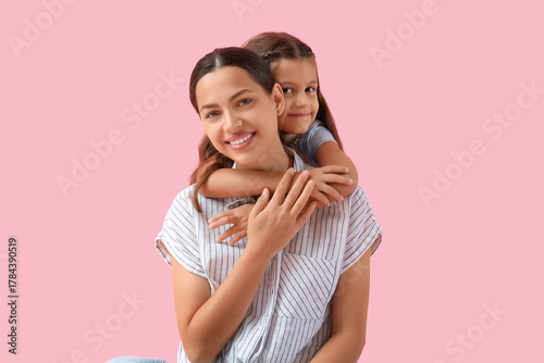 Embracing little girl with ...