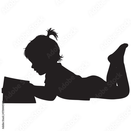 Sweet silhouette of a child engrossed in reading a book, perfect for promoting literacy and childhood education initiatives with heartwarming appeal