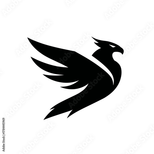 Black silhouette of soaring bird design for logo or symbol on white background