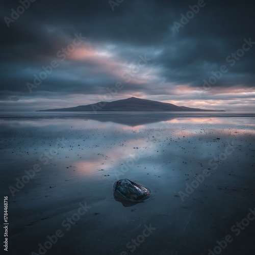 Fototapeta Naklejka Na Ścianę i Meble -  Solitary Rock and Dark Stormy Seascape at Sunset