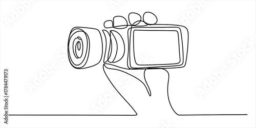 Continuous line art drawing of a hand holding a video camera, symbolizing modern content creation, digital media, and cinematic vision.