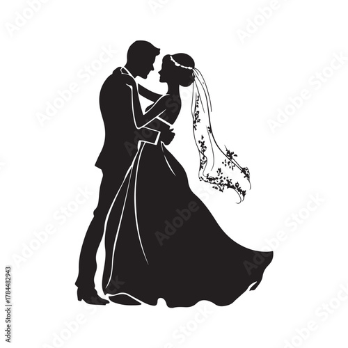 Romantic silhouette of a bride and groom embracing tenderly on their wedding day in a classic elegant pose silhouette