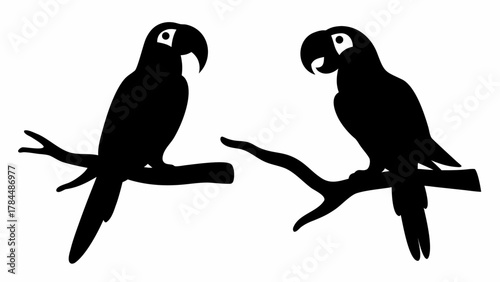 Silhouette illustration of two parrots perched on branches facing each other in a simple black design