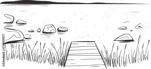 Lakeside dock with reeds and rocks water
