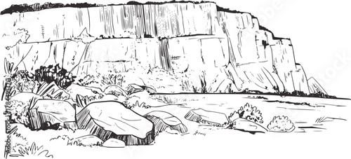 Rocky cliff face with water and boulders nature