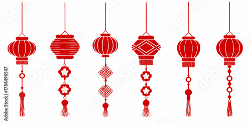 Collection of traditional red chinese lanterns with decorative tassels and charms hanging on white background