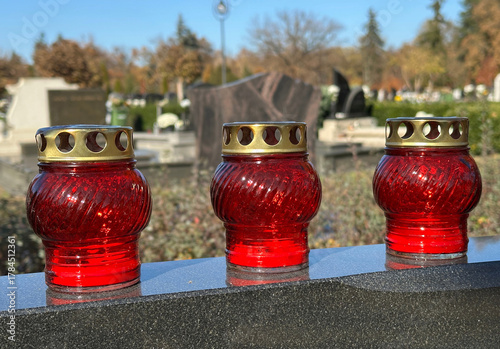 Candlelits on a tombstone in the public cemetery