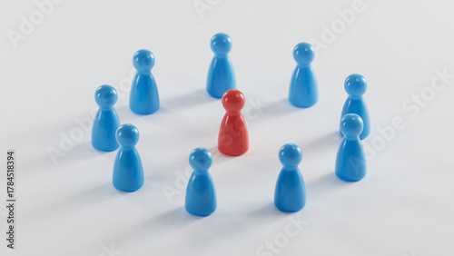 Red Game Figure Standing Out Among Blue Counterparts on a Light Gray Background