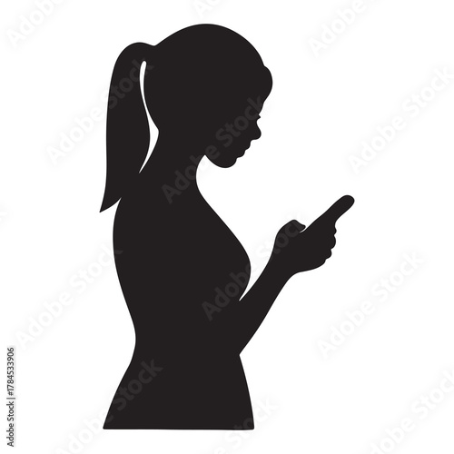 Silhouette of a young woman with her hair in a ponytail looking down at her smartphone