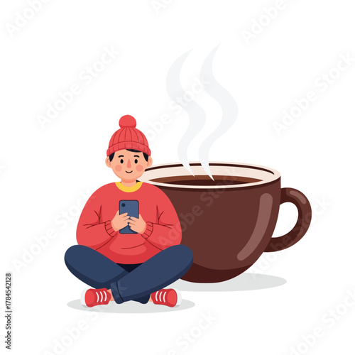 Cozy person relaxing with phone and steaming coffee cup indoors