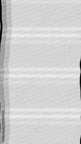 Vertical Analog Noise Loop For Video Effects And Transitions. Looping vertical video of black and white television static noise. Perfect for retro effects and transitions.