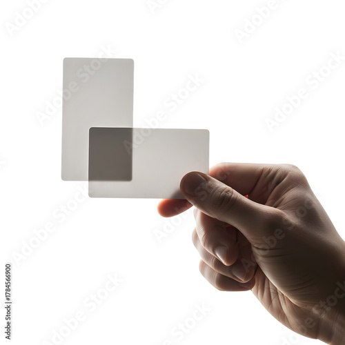 Hand holding a translucent card against a dark background isolated on transparent background
