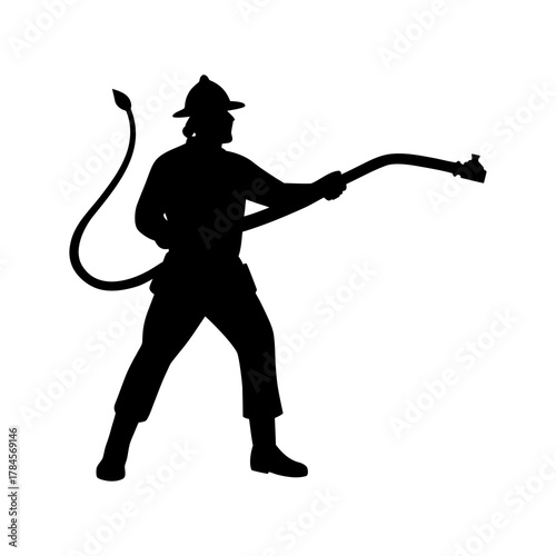 silhouette of a firefighter holding water hose 