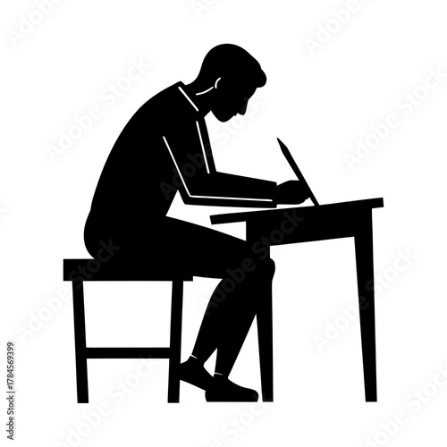 silhouette of a person writing on desk with paper