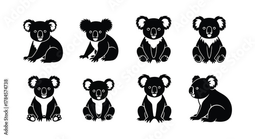 Eight koalas sitting in two rows looking forward