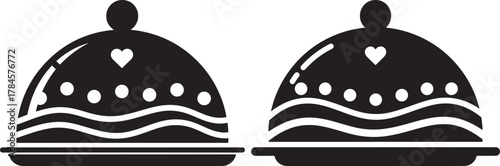 Two decorative dessert cakes with hearts and waves silhouette