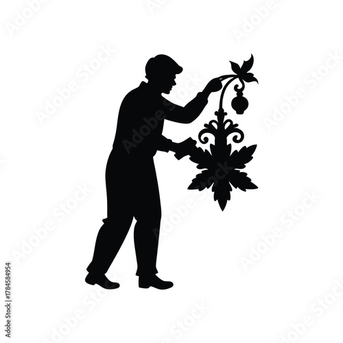 Silhouette Of Man Working With Ornamental Plant Decoration For Wall Isolated