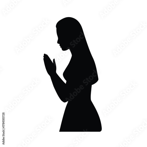 Silhouette of woman in prayer position praying in hope asking for help