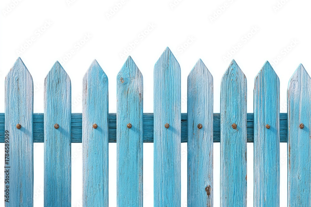 Fototapeta premium A weathered, light-blue wooden fence. Horizontal, detailed view of the fence's top section. Aged planks with pointed tops, and visible metal fasteners