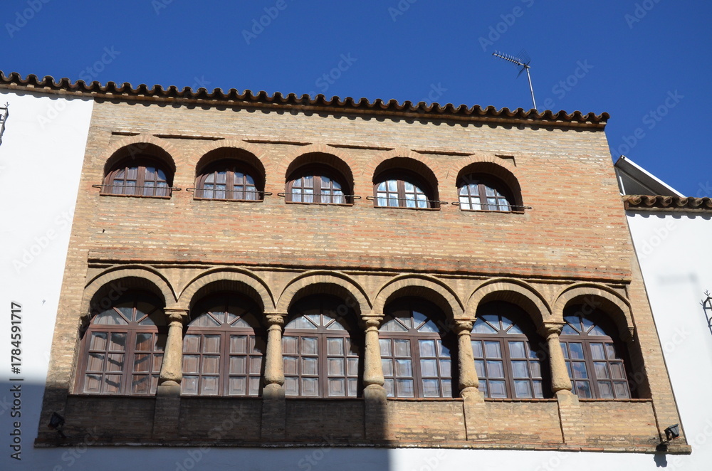 Obraz premium Cordoba, Spain 03.27.2019: House on Calle San Fernando with old water trough set in wall