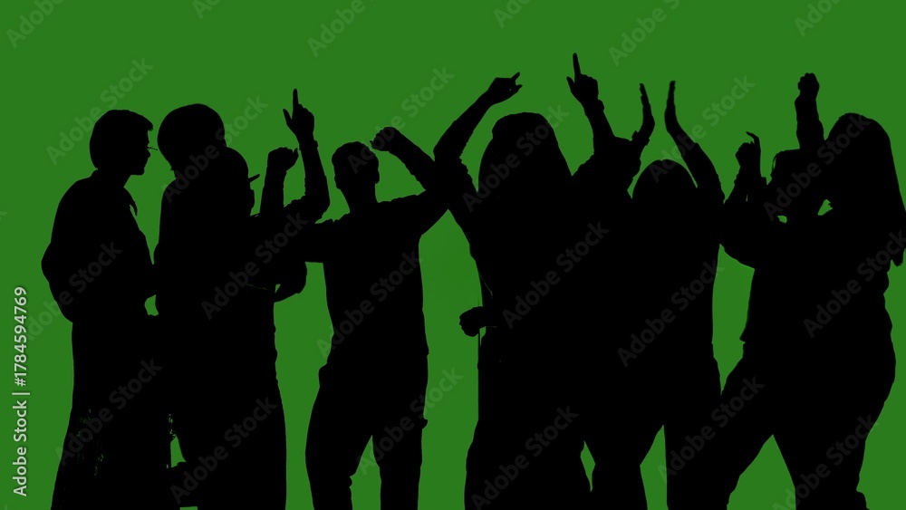 Fototapeta premium Black isolated silhouettes of people dancing cheerfully on a green chroma key background. Minimalist contrast and modern visual composition, mockup.