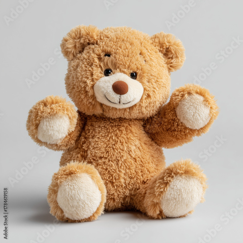 A smiling and cheerful teddy bear sits and reaches out to us.