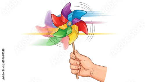 A hand holds a colorful pinwheel spinning with motion blur