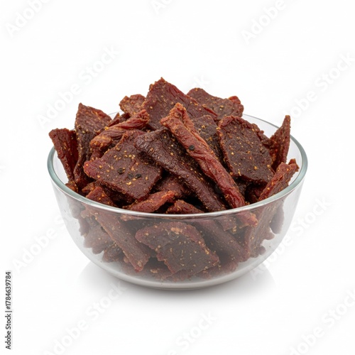 A bowl of beef jerky isolated on white