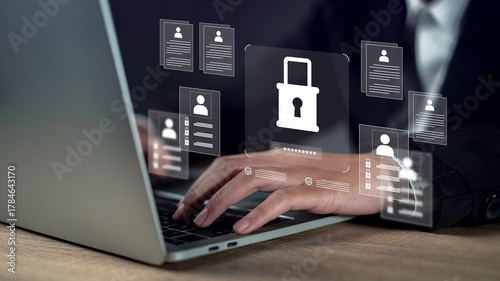 Management confidentiality and employee verification concept with businessman using laptop, reviewing secure digital documents and protected user data in a confidential business system interface.