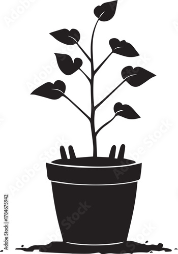 Silhouette of Plant in Pot: An elegant silhouette of a plant thriving inside a pot, symbolizing growth and the nurturing of life.