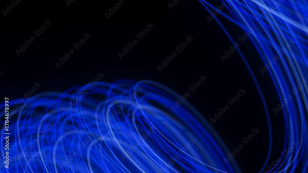 Obraz premium Blue light trails curve and overlap on a black background. Abstract long-exposure effect creates a sense of motion, energy, and futuristic digital flow.