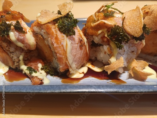 Sushi salmon mentai with lemon sauce and celery 
