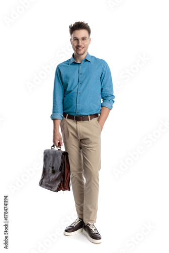 Happy casual man with glasses and briefcase standing