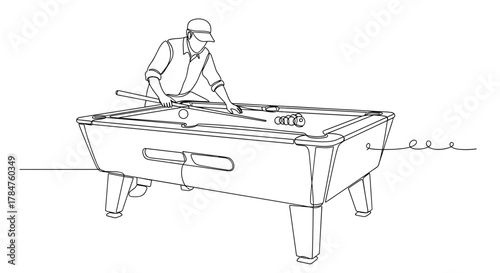 Man playing pool and carefully aiming at the shot on table  
