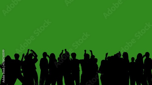 Black isolated silhouettes of people dancing cheerfully on a green chroma key background. Minimalist contrast and modern visual composition, mockup.