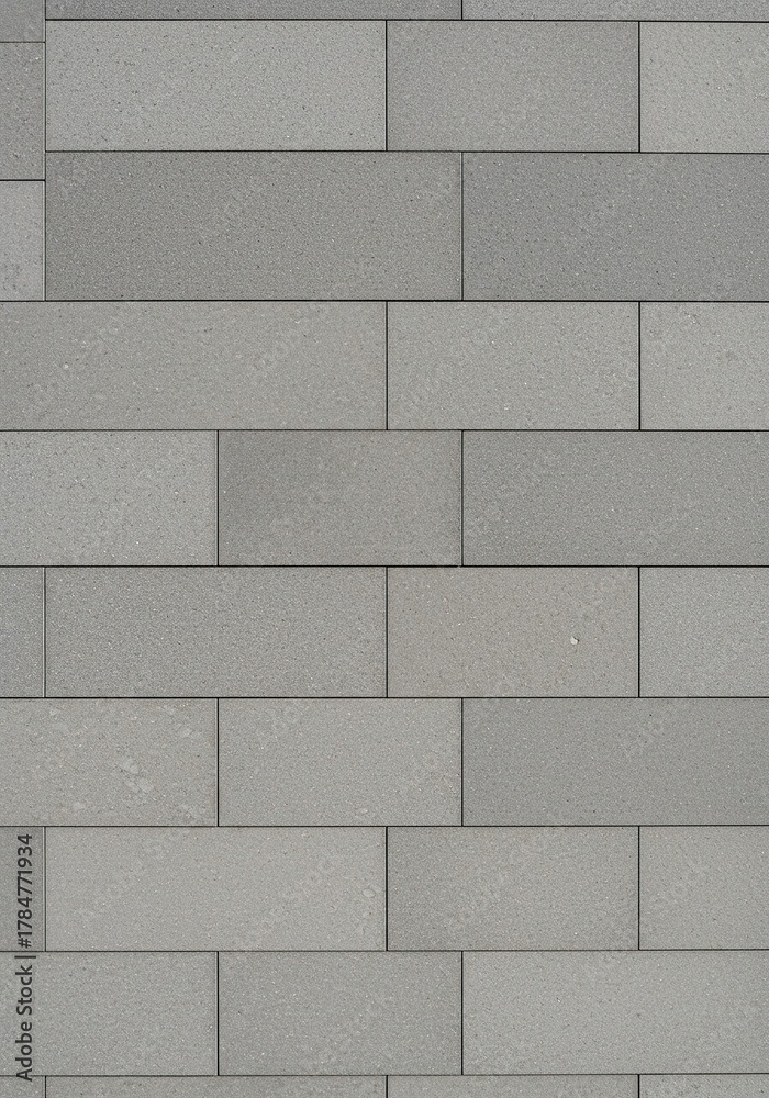 Naklejka premium A seamlessly laid flat surface of uniform tiles creating a smooth and expansive background, ideal for various design projects and architectural concepts ,architecture ,grid ,minimalist
